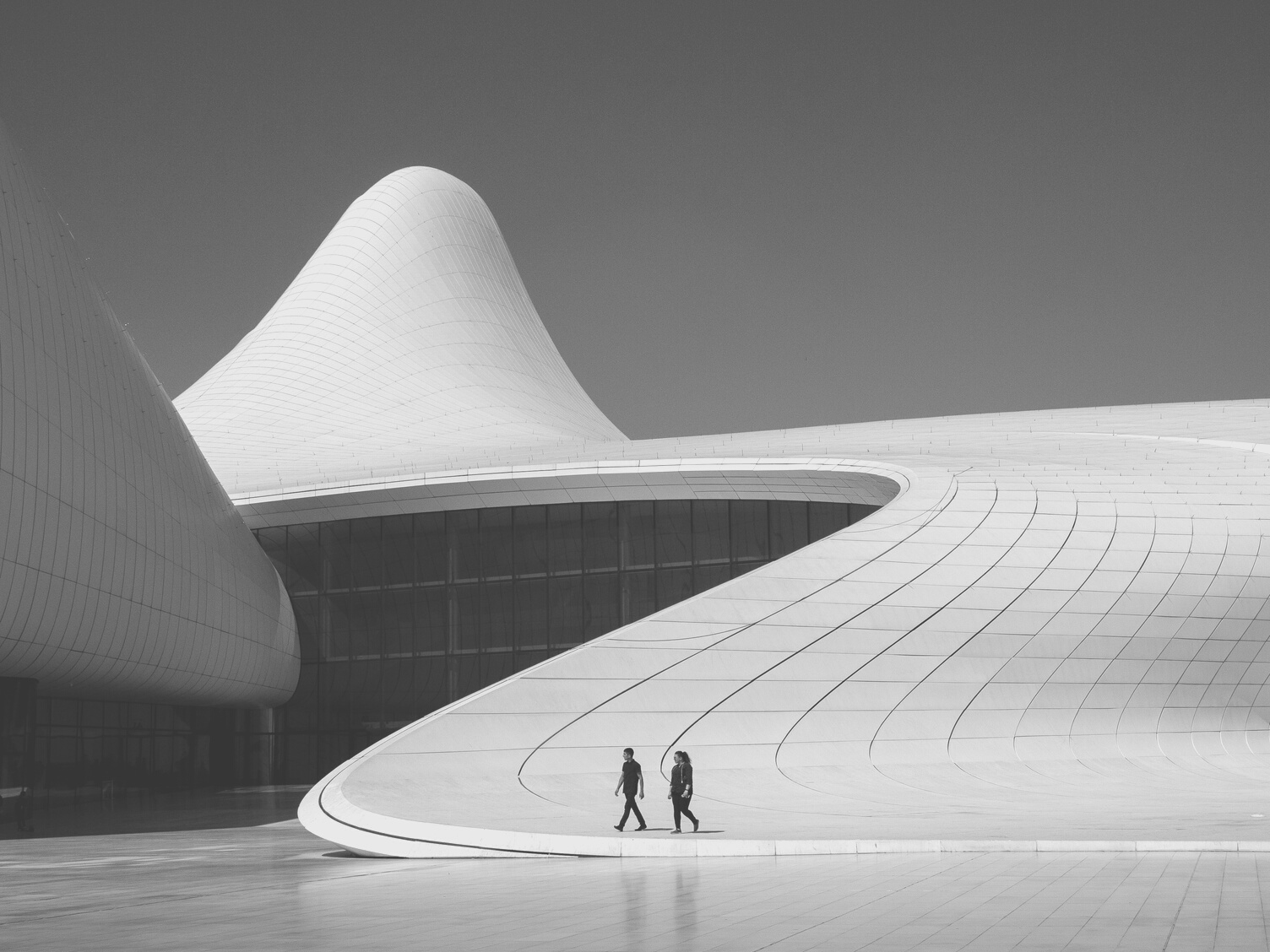People walking outside modern building